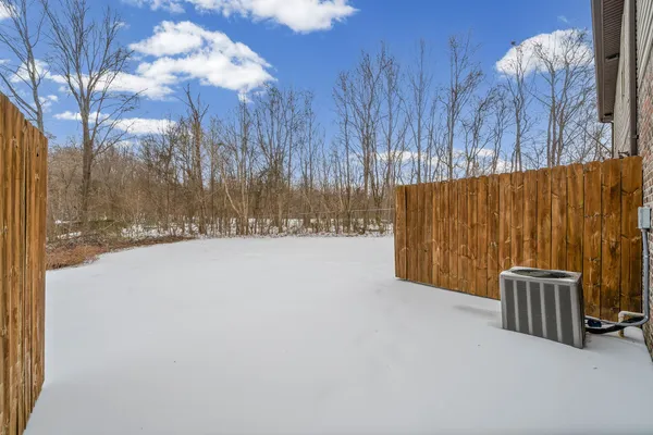 a view of outdoor space with wooden fence