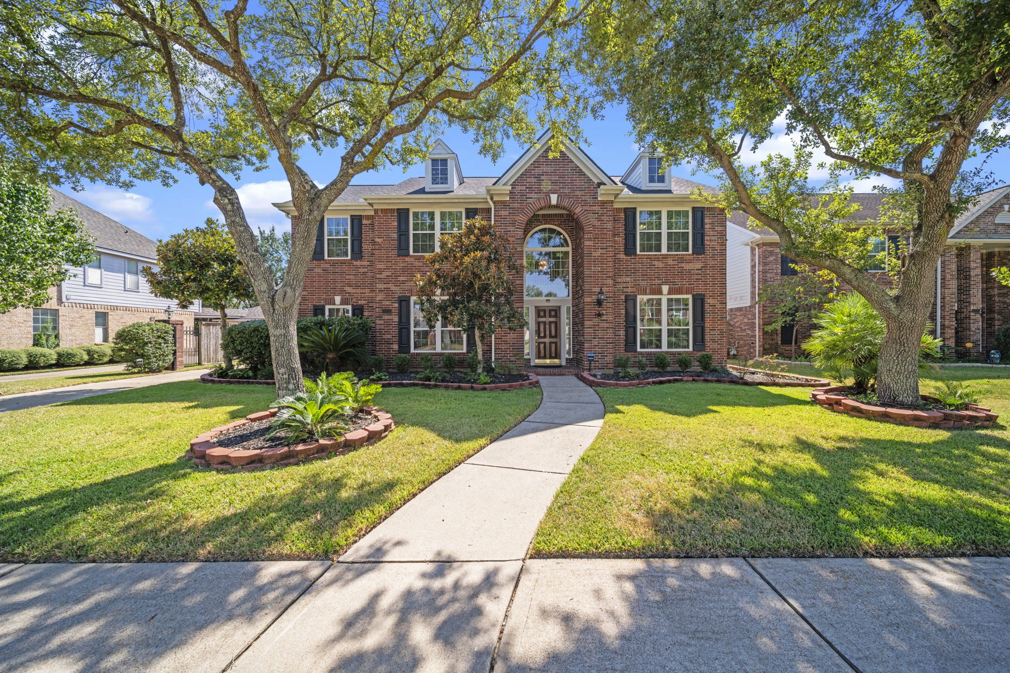 20727 Shadow Mill Court Katy, TX 77450 - Photo 1 of 48 a front view of a house with a yard table and chairs
