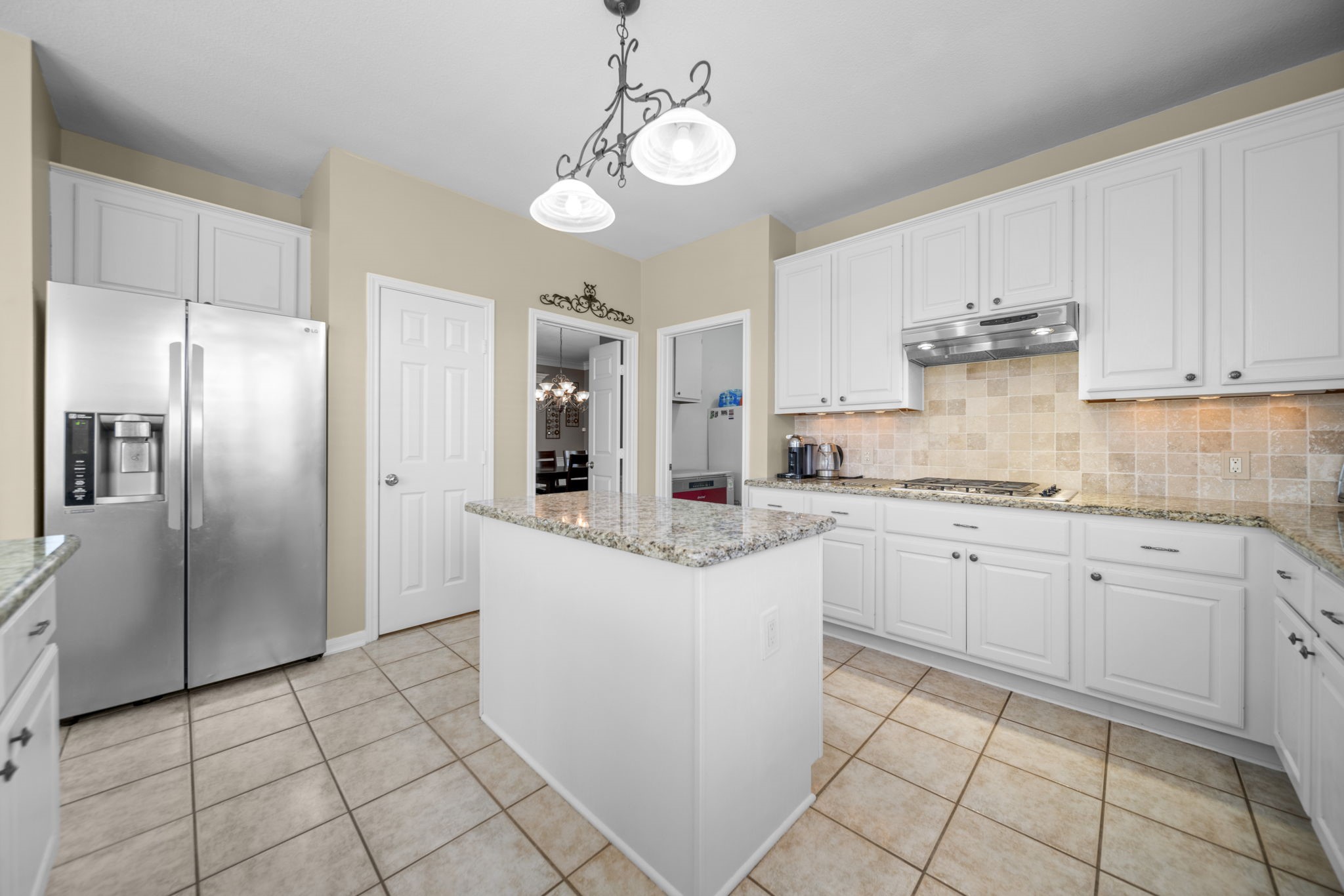 20727 Shadow Mill Court Katy, TX 77450 - Photo 14 of 48 a kitchen with granite countertop cabinets and stainless steel appliances