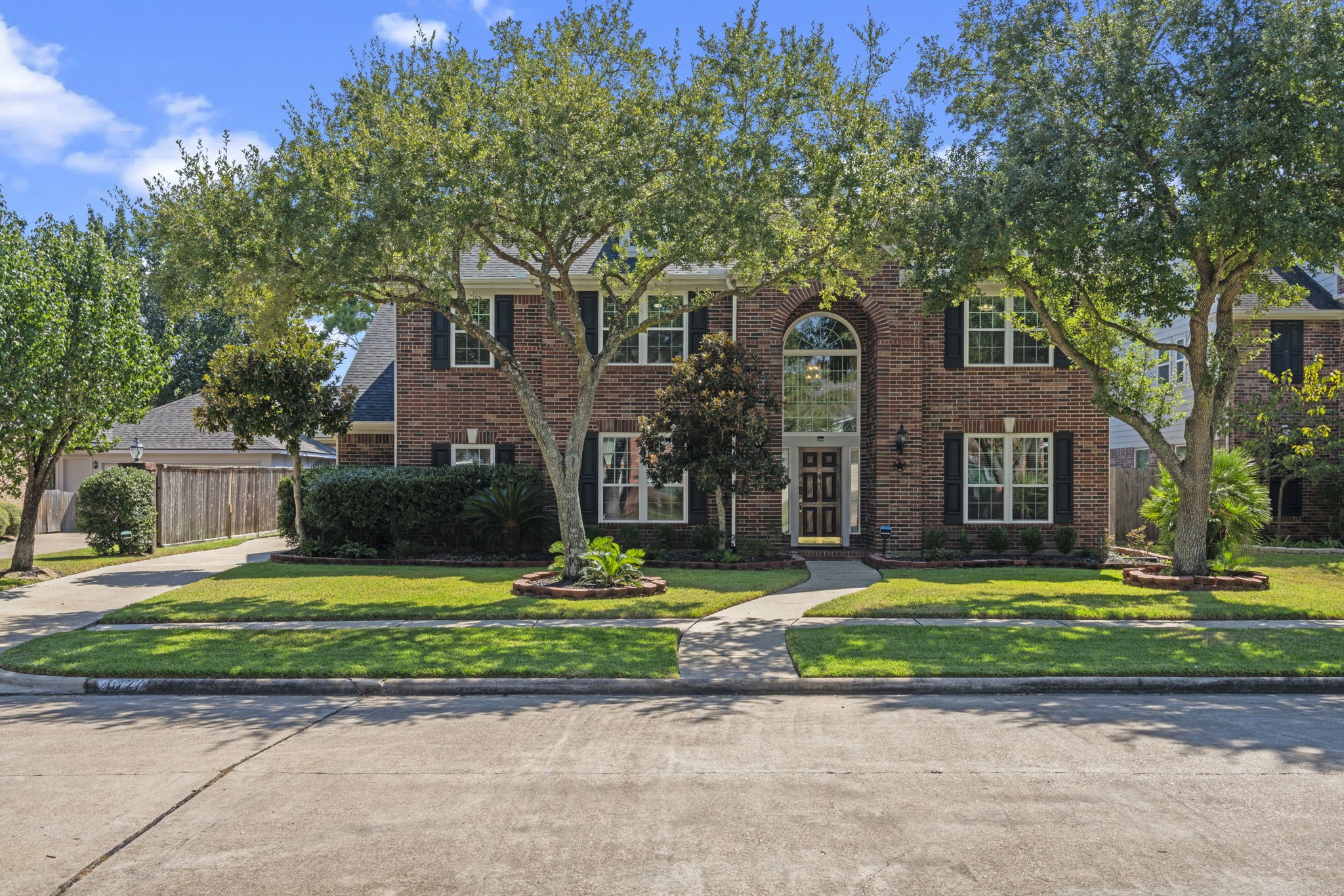 20727 Shadow Mill Court Katy, TX 77450 - Photo 2 of 48 a front view of a house with a yard and garage