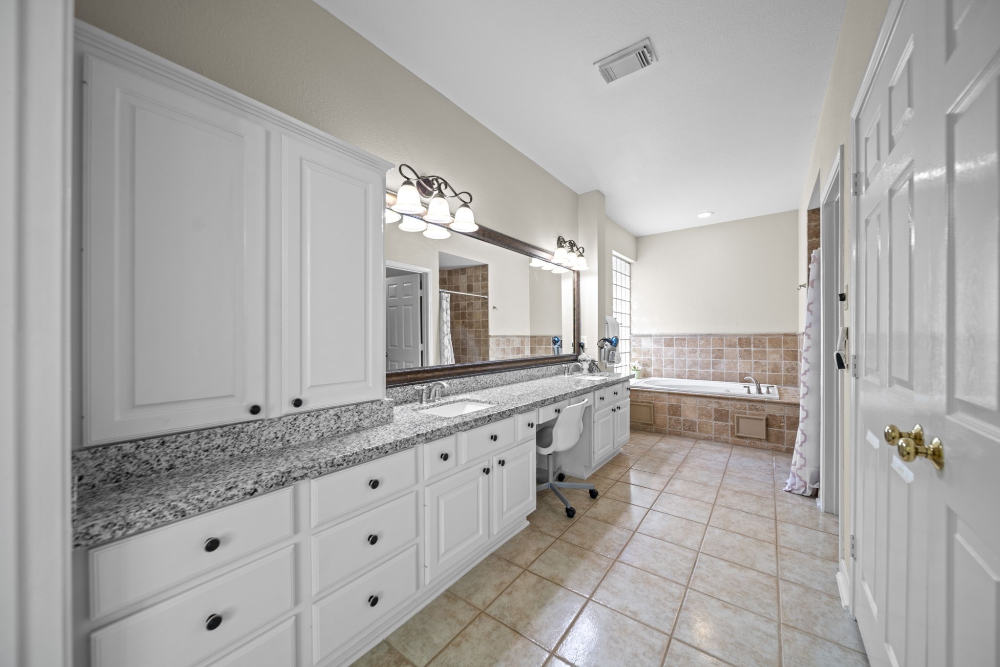 20727 Shadow Mill Court Katy, TX 77450 - Photo 24 of 48 a bathroom with a granite countertop double vanity sink a mirror and a bathtub