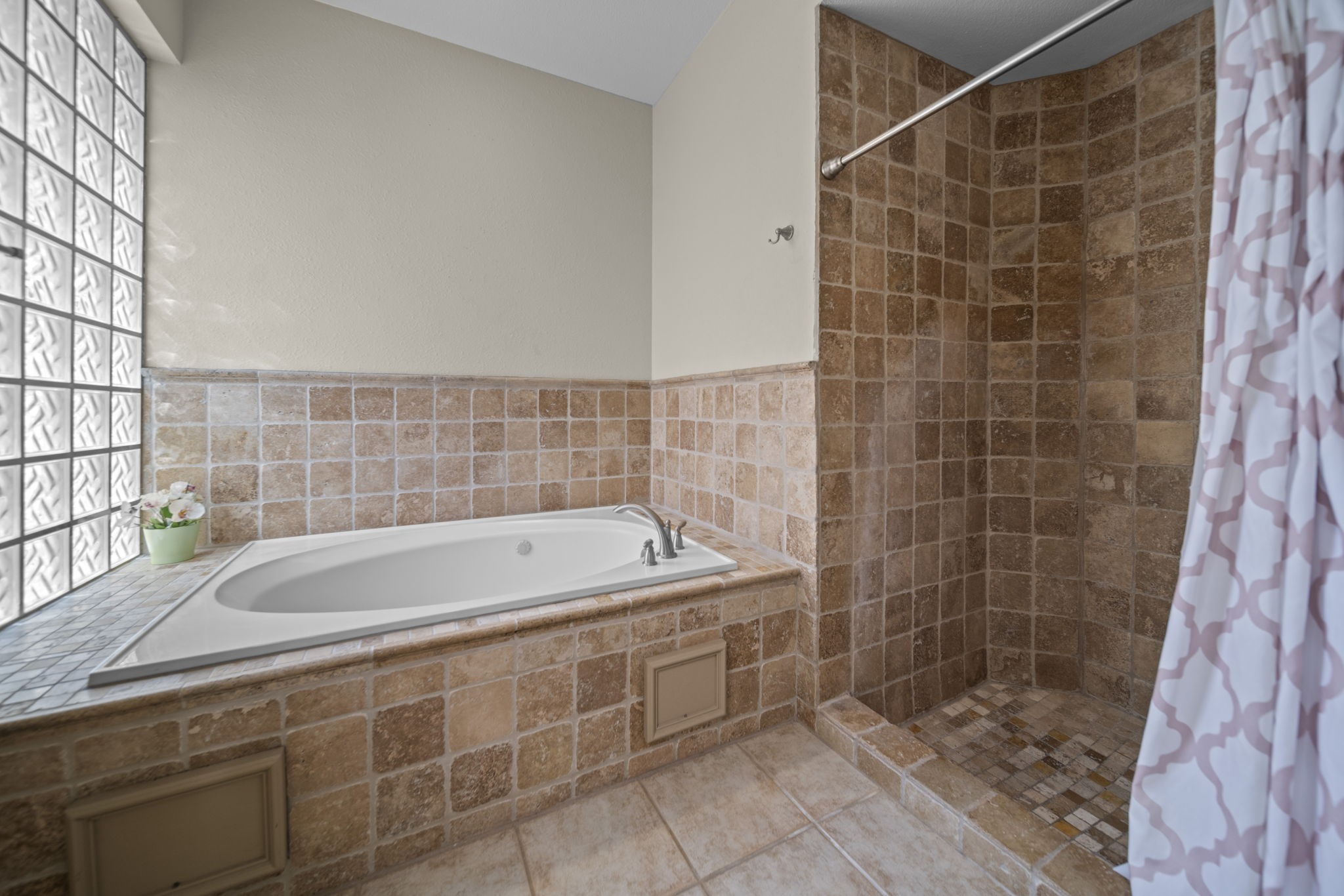 20727 Shadow Mill Court Katy, TX 77450 - Photo 25 of 48 a bathroom with a bathtub and a shower