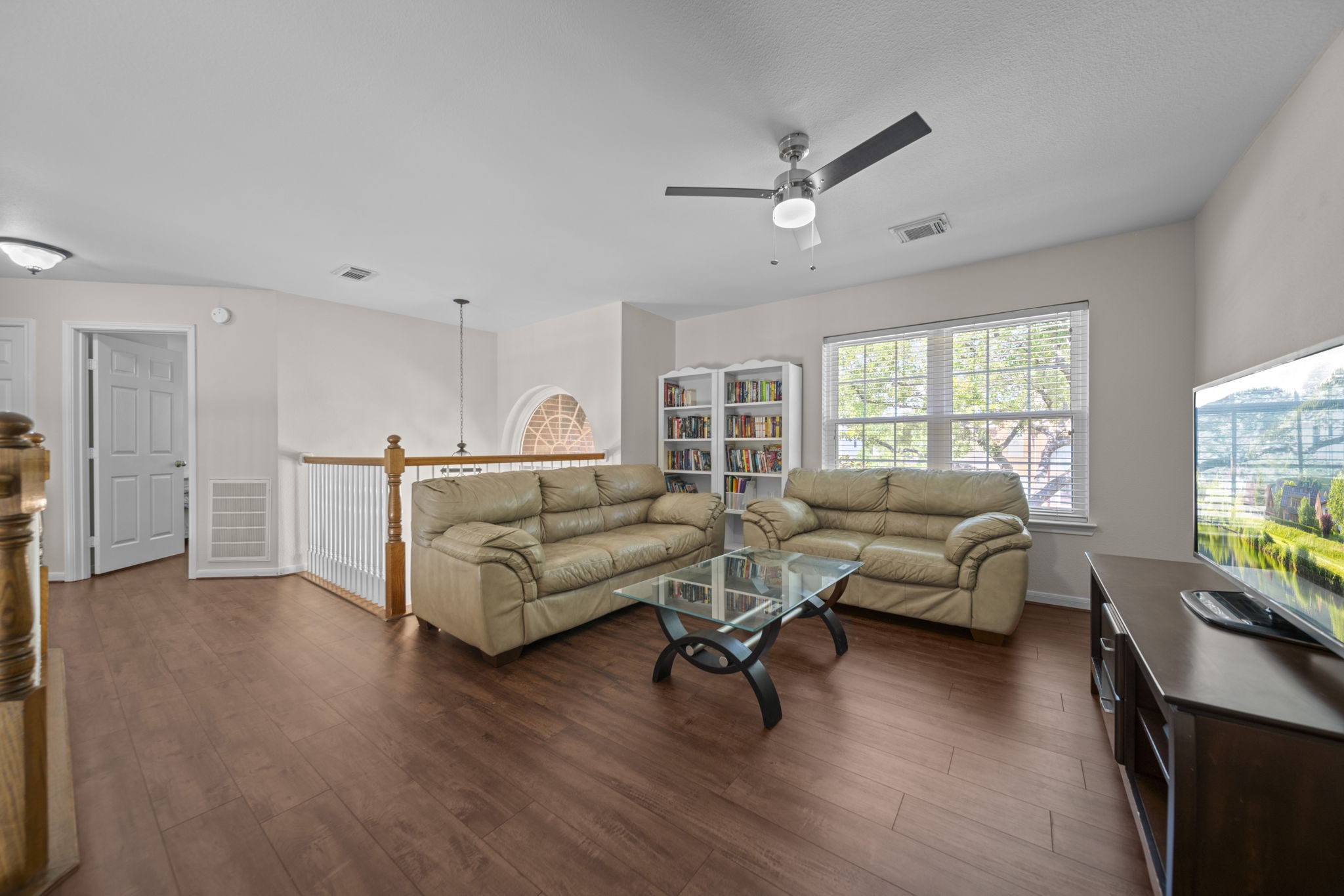 20727 Shadow Mill Court Katy, TX 77450 - Photo 27 of 48 a living room with furniture and a wooden floor