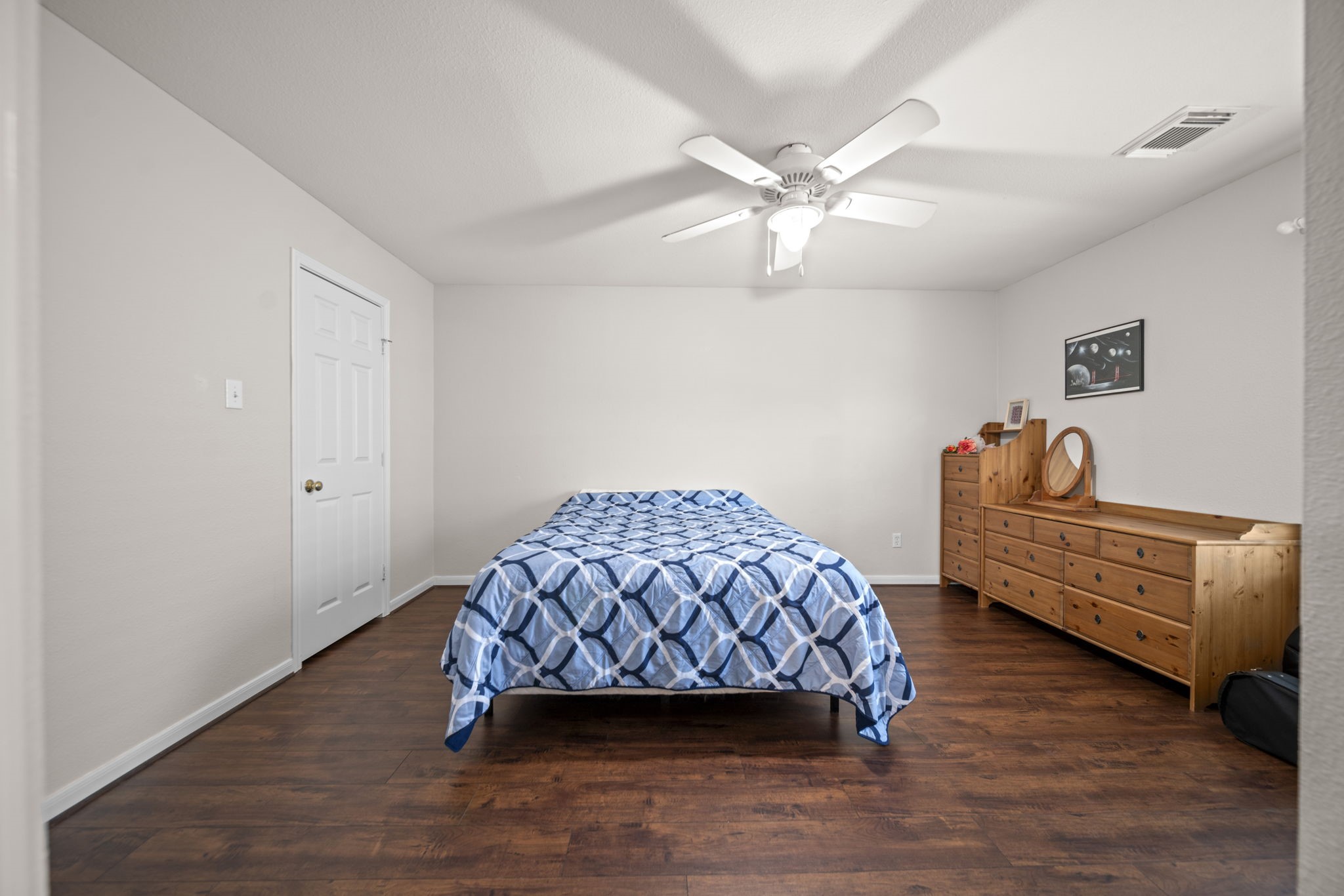 20727 Shadow Mill Court Katy, TX 77450 - Photo 29 of 48 a bedroom with a bed and a chandelier