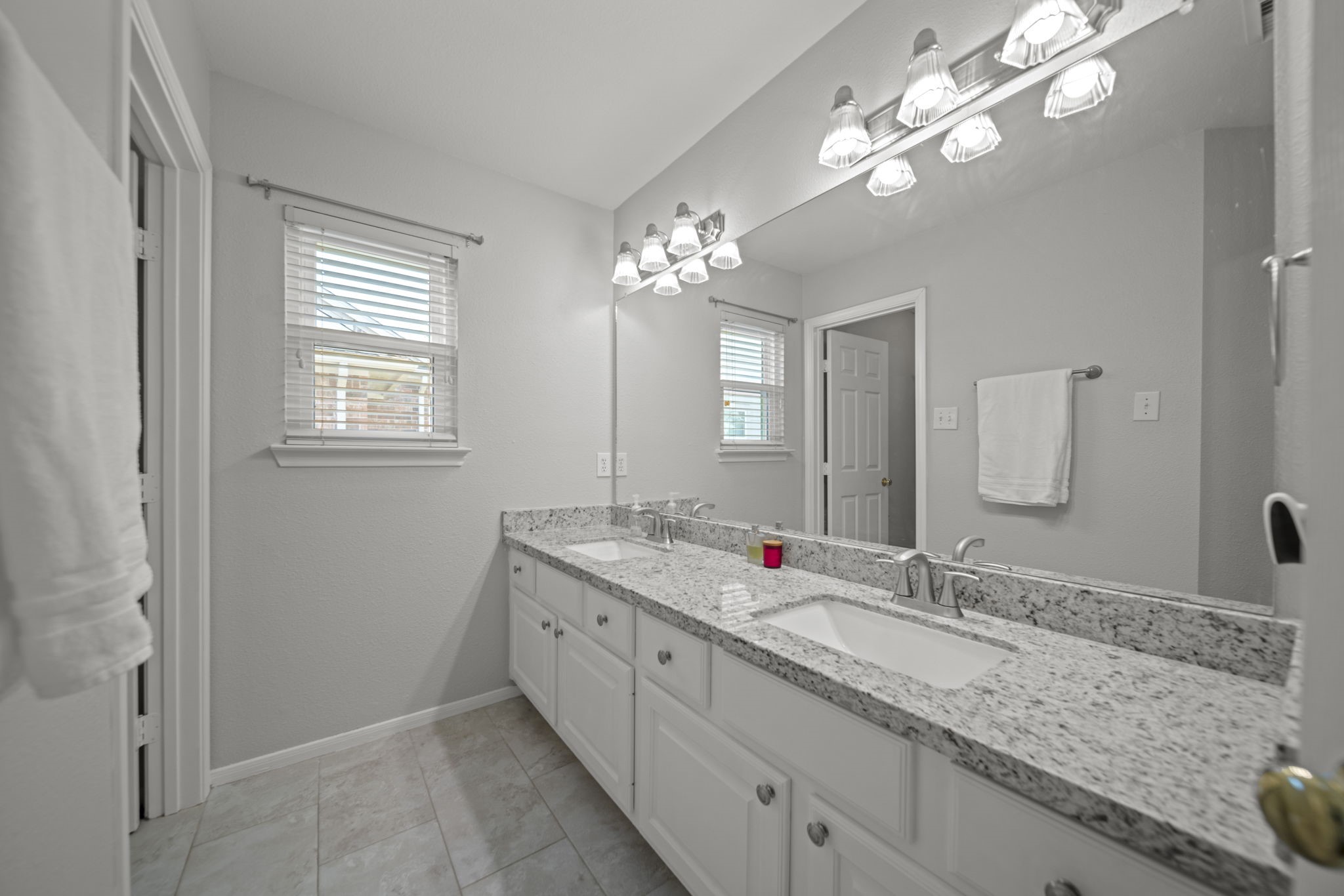 20727 Shadow Mill Court Katy, TX 77450 - Photo 31 of 48 a bathroom with a granite countertop double vanity sink and a mirror