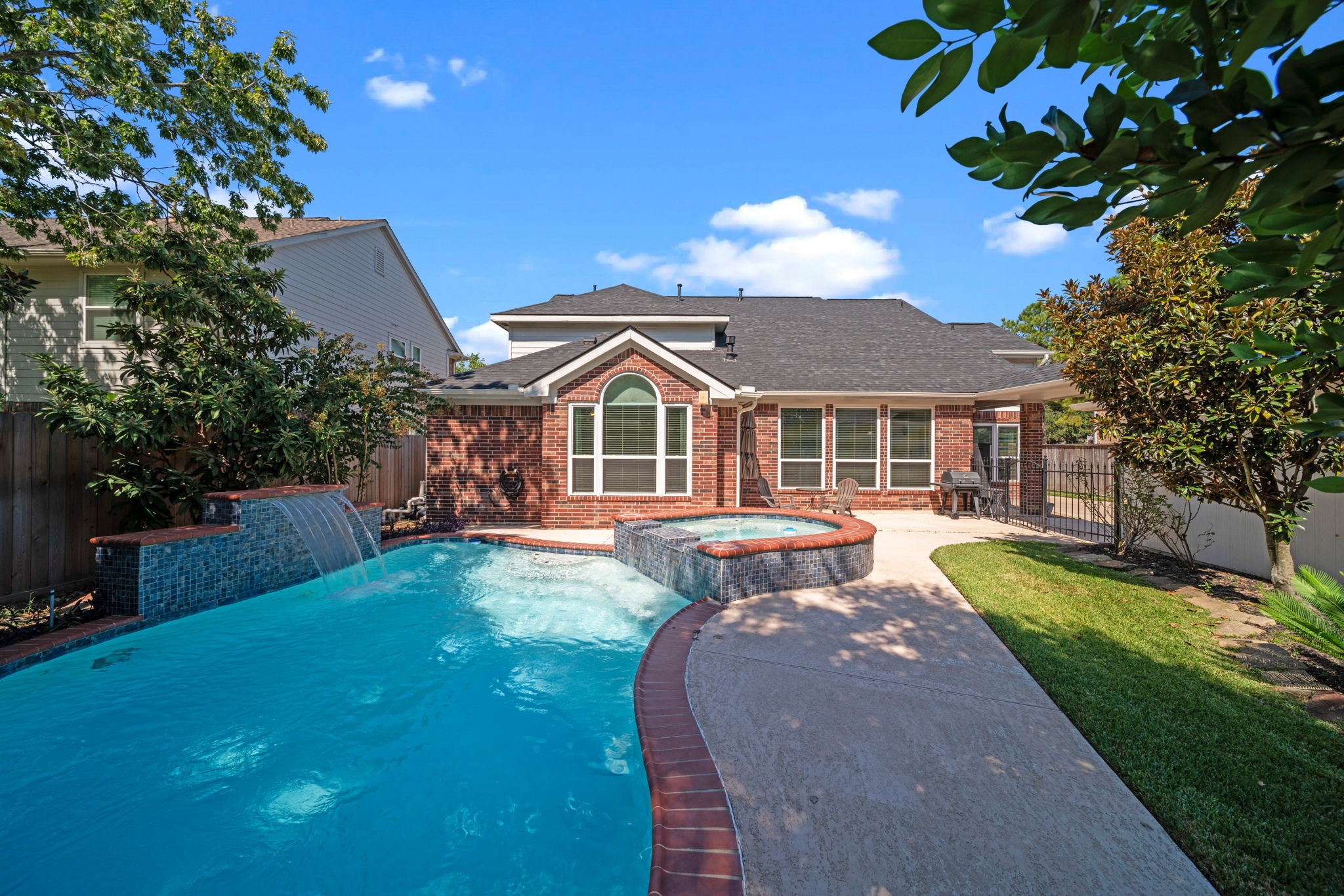 20727 Shadow Mill Court Katy, TX 77450 - Photo 40 of 48 a front view of a house with swimming pool having outdoor seating