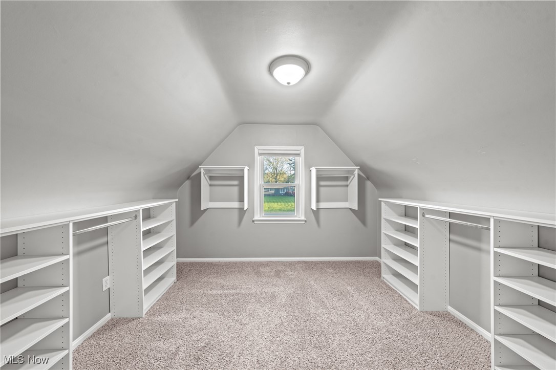 6315 Brookside Road Independence, OH 44131 - Photo 26 of 41 Walk in closet with carpet floors and lofted ceiling