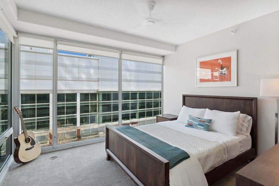1720 Maple Avenue, Unit 405 Evanston, IL 60201 - Photo 11 of 17 a bedroom with a bed and a large window