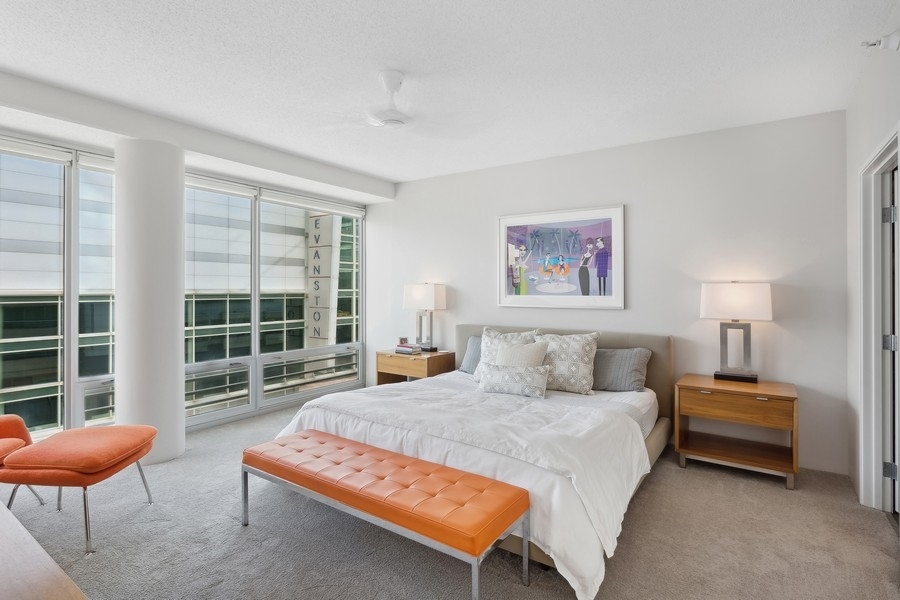 1720 Maple Avenue, Unit 405 Evanston, IL 60201 - Photo 8 of 17 a bedroom with furniture and a large window