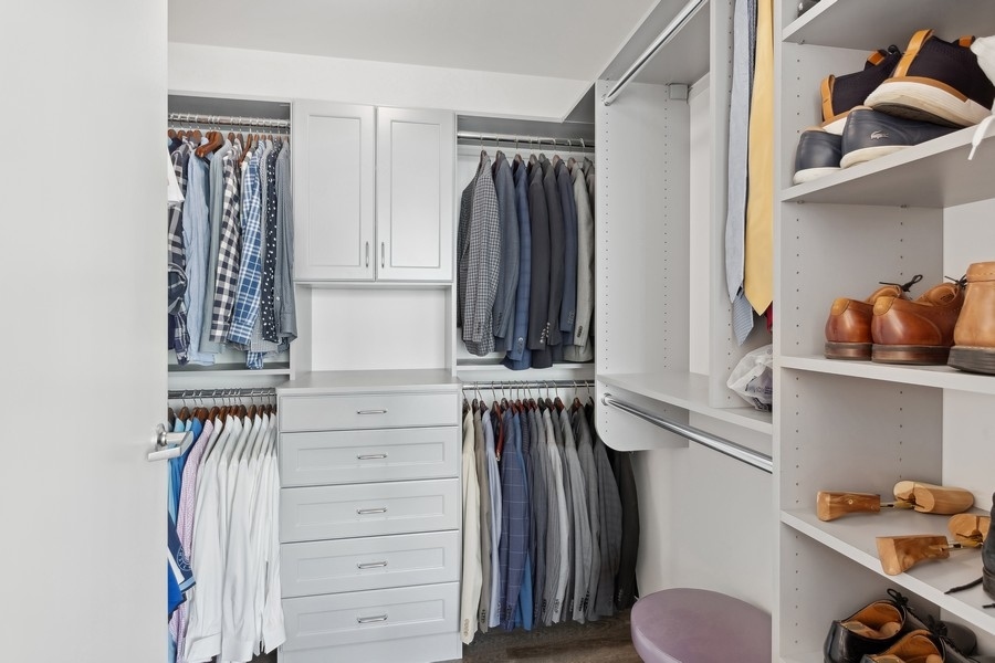 1720 Maple Avenue, Unit 405 Evanston, IL 60201 - Photo 10 of 17 a view of walk in closet with clothes and shoes