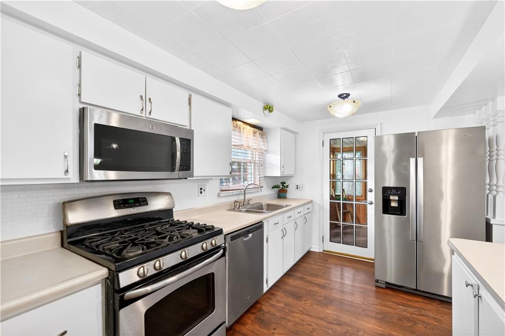 205 Hartle Road Glenshaw, PA 15116 - Photo 15 of 36 a kitchen with stainless steel appliances stove top oven and cabinets