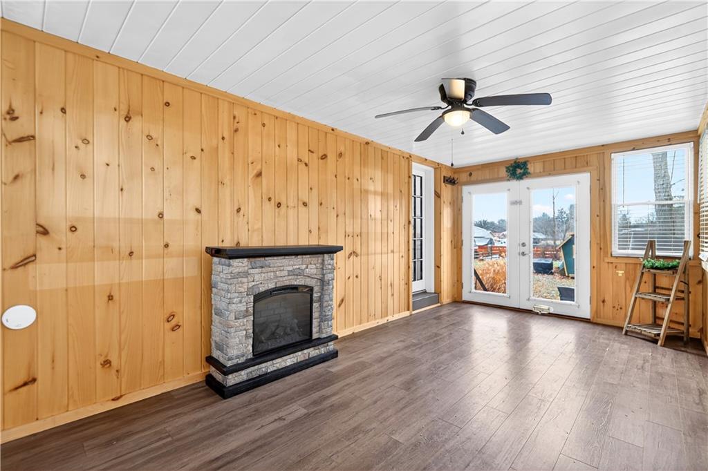 205 Hartle Road Glenshaw, PA 15116 - Photo 18 of 36 a view of a livingroom with a fireplace wooden floor and windows