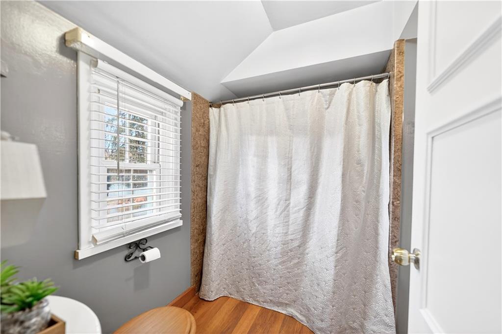 205 Hartle Road Glenshaw, PA 15116 - Photo 20 of 36 a bathroom with a window and a shower