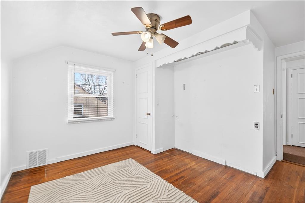 205 Hartle Road Glenshaw, PA 15116 - Photo 25 of 36 a bedroom with a bed and a ceiling fan