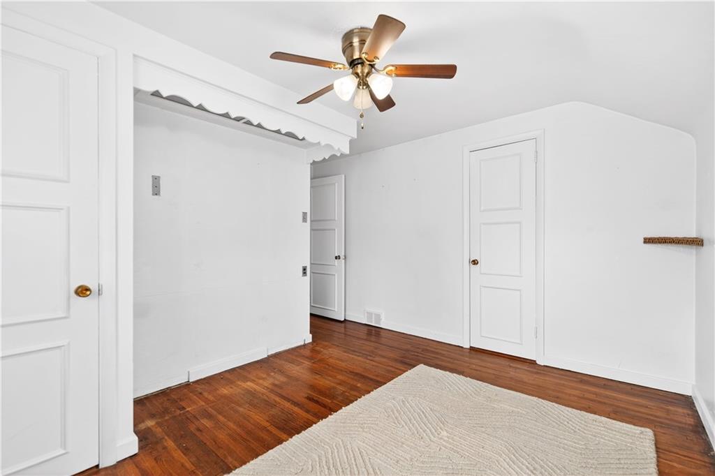 205 Hartle Road Glenshaw, PA 15116 - Photo 26 of 36 a bedroom with a bed and a chandelier fan