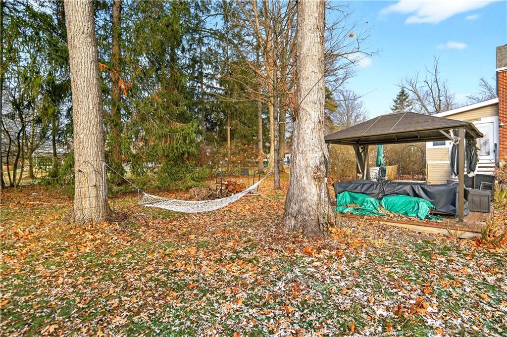 205 Hartle Road Glenshaw, PA 15116 - Photo 29 of 36 a view of a garden with a tree in front of the house