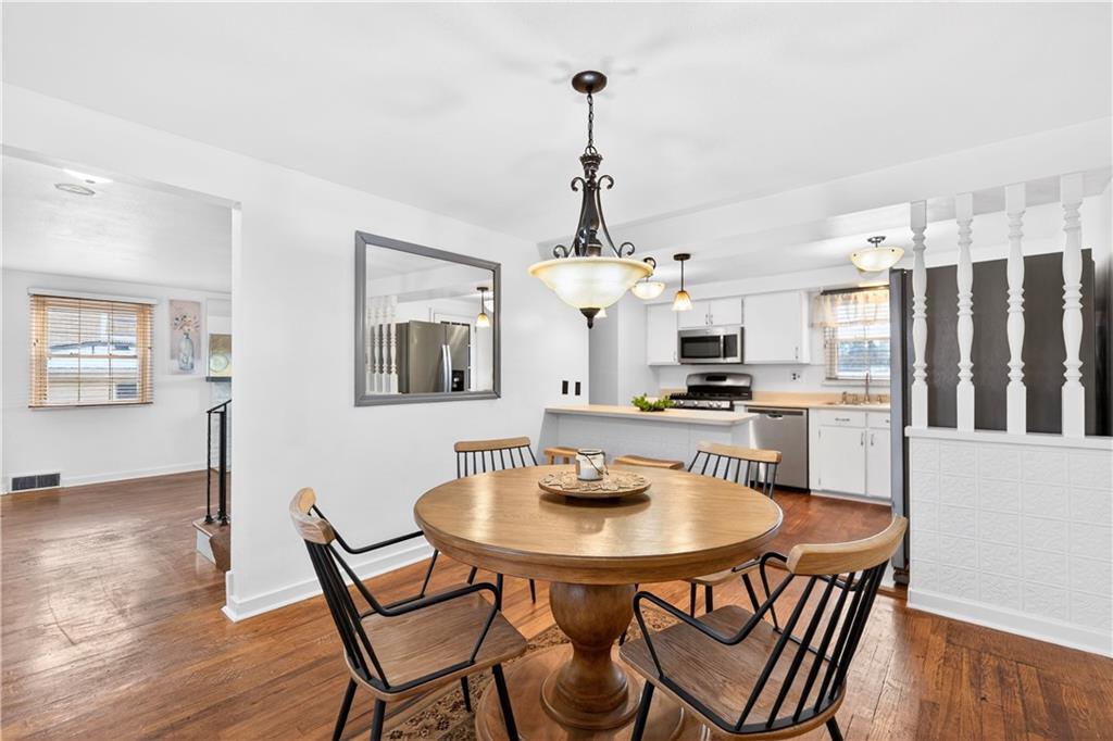 205 Hartle Road Glenshaw, PA 15116 - Photo 10 of 36 a view of a dining room with furniture and wooden floor