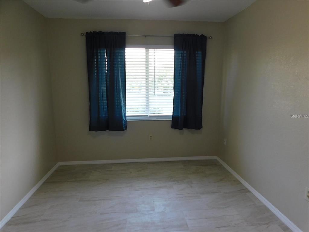 21150 Gertrude Avenue, Unit B4 Port Charlotte, FL 33952 - Photo 6 of 10 an empty room with a window