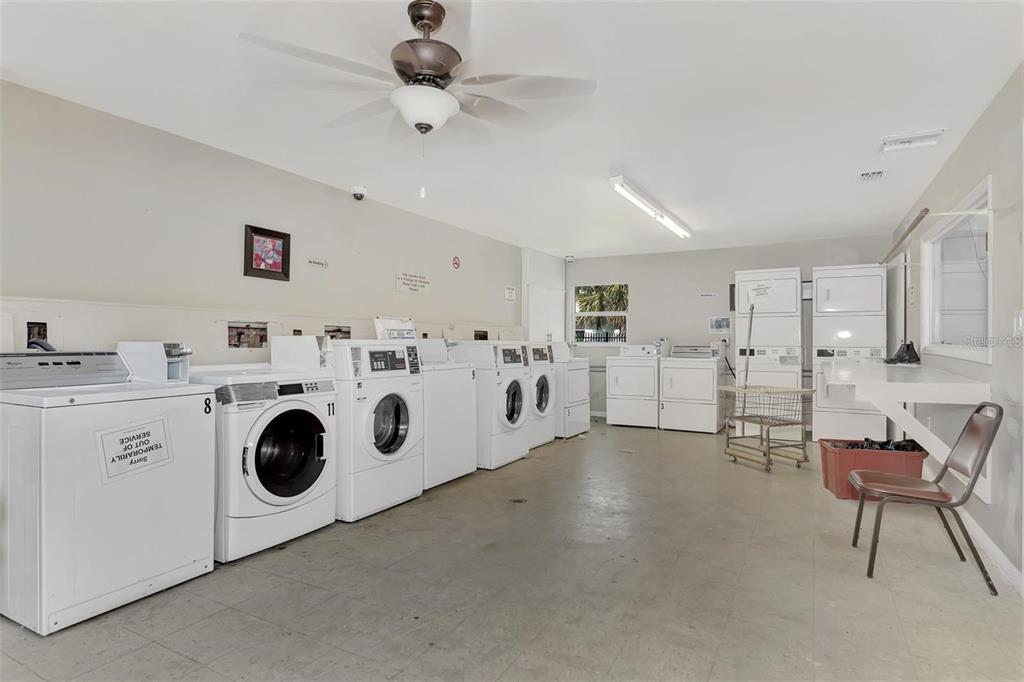 21150 Gertrude Avenue, Unit B4 Port Charlotte, FL 33952 - Photo 10 of 10 a utility room with multiple dryer and washer