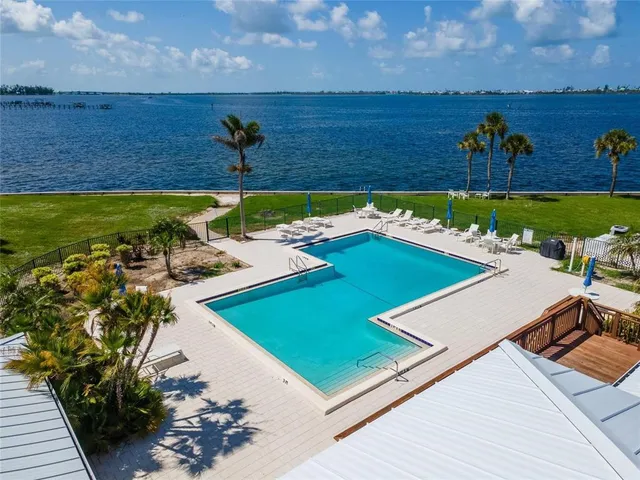 a view of a pool with a yard