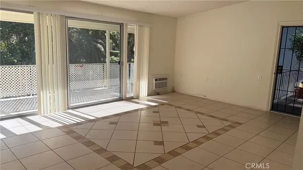 a view of an empty room and window