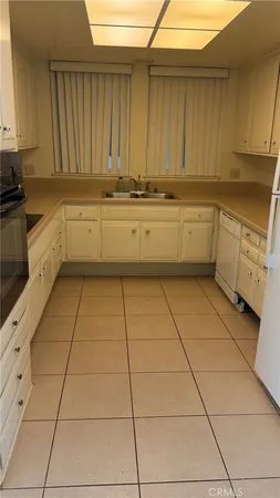 a kitchen with a cabinets and window