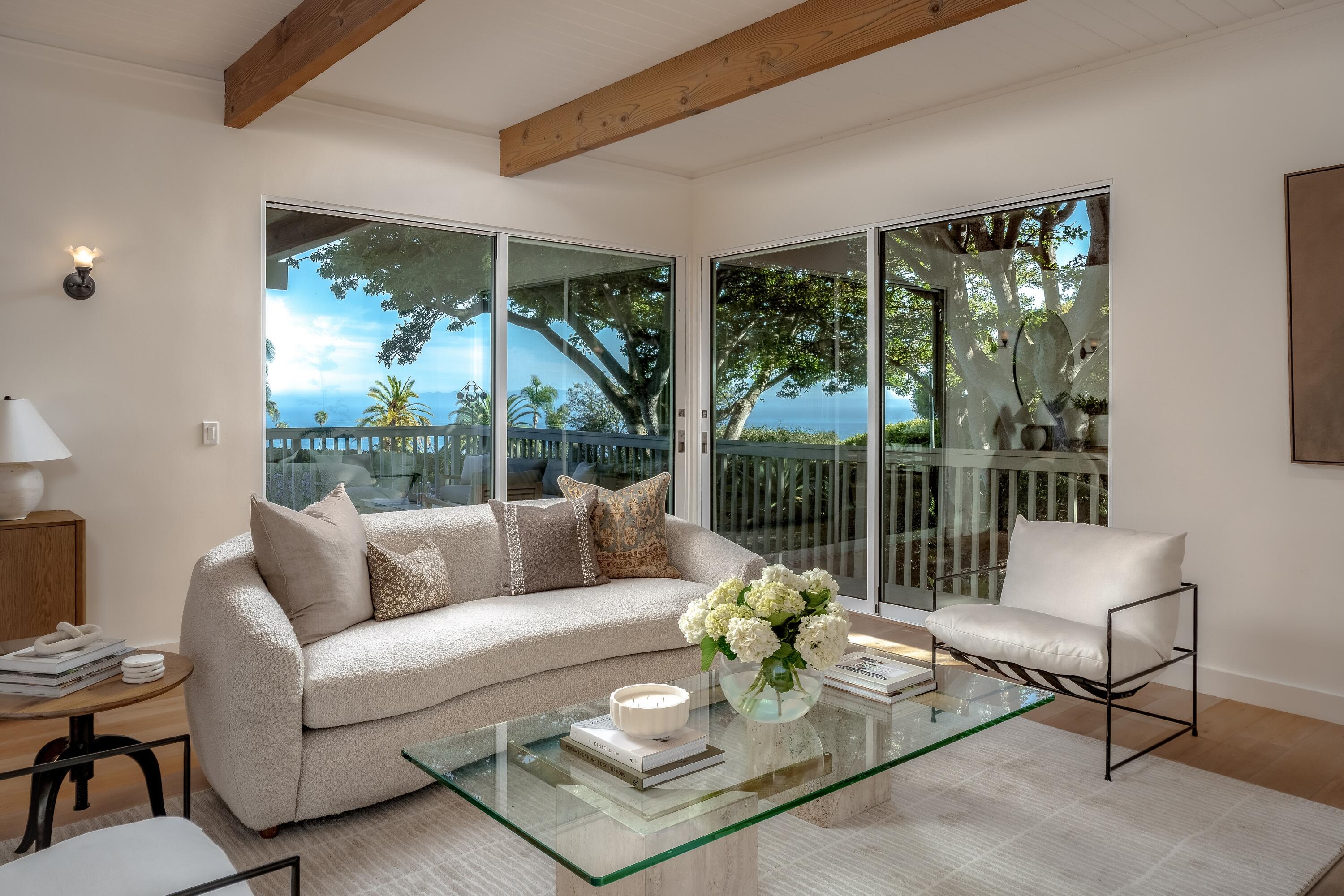 626 Sea Ranch Drive Santa Barbara, CA 93109 - Photo 15 of 38 a living room with furniture and a large window