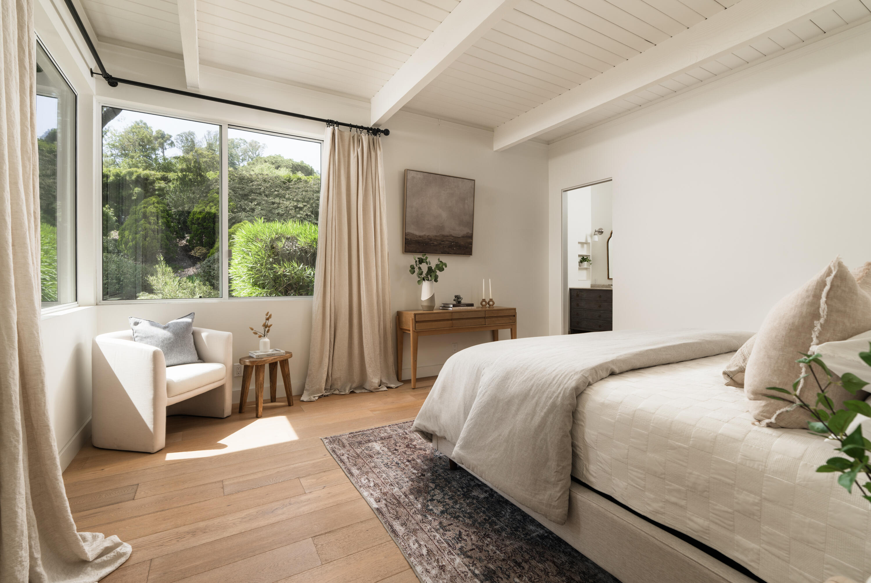 626 Sea Ranch Drive Santa Barbara, CA 93109 - Photo 24 of 38 a bedroom with a bed and large window