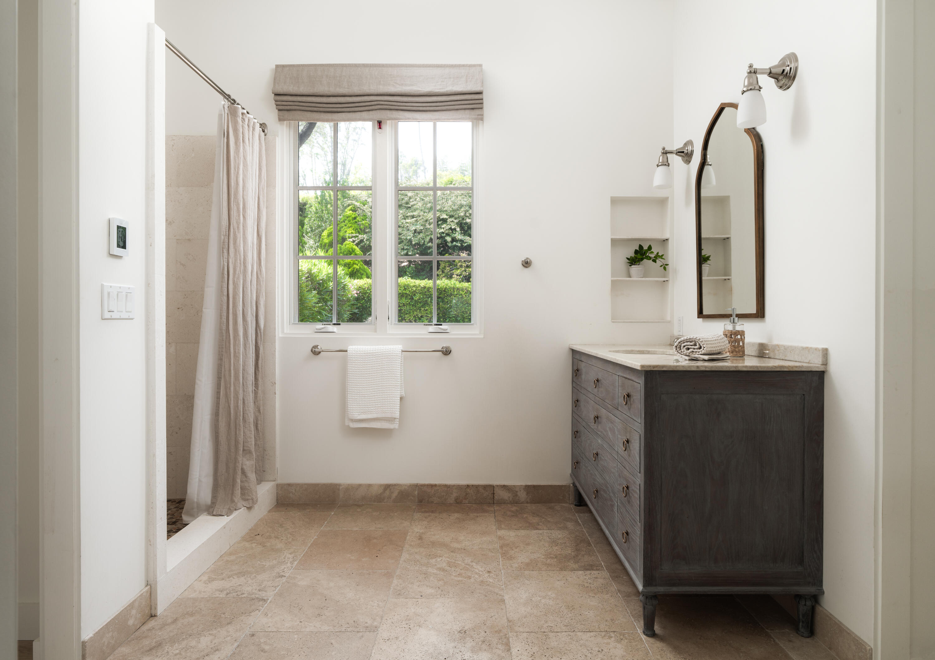 626 Sea Ranch Drive Santa Barbara, CA 93109 - Photo 26 of 38 a bathroom with a double vanity sink and mirror