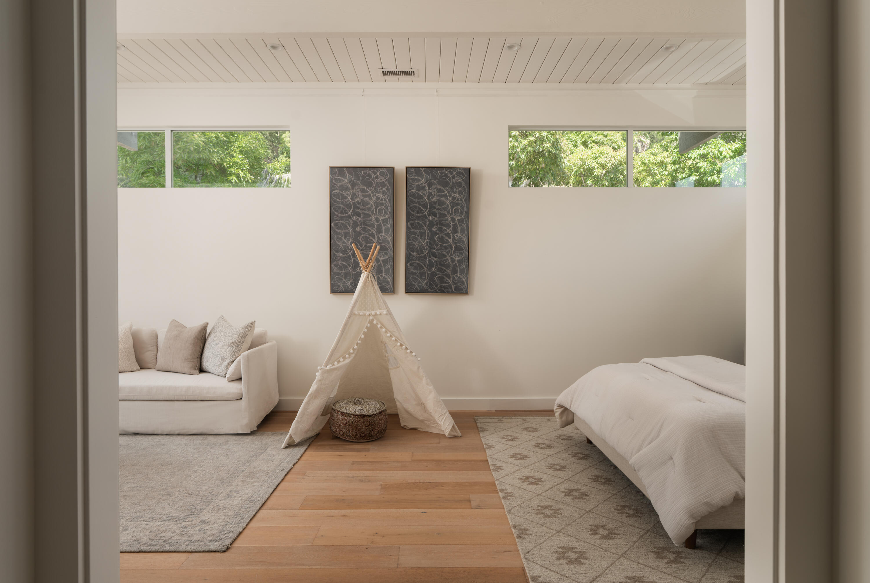 626 Sea Ranch Drive Santa Barbara, CA 93109 - Photo 27 of 38 a living room with furniture and a bed