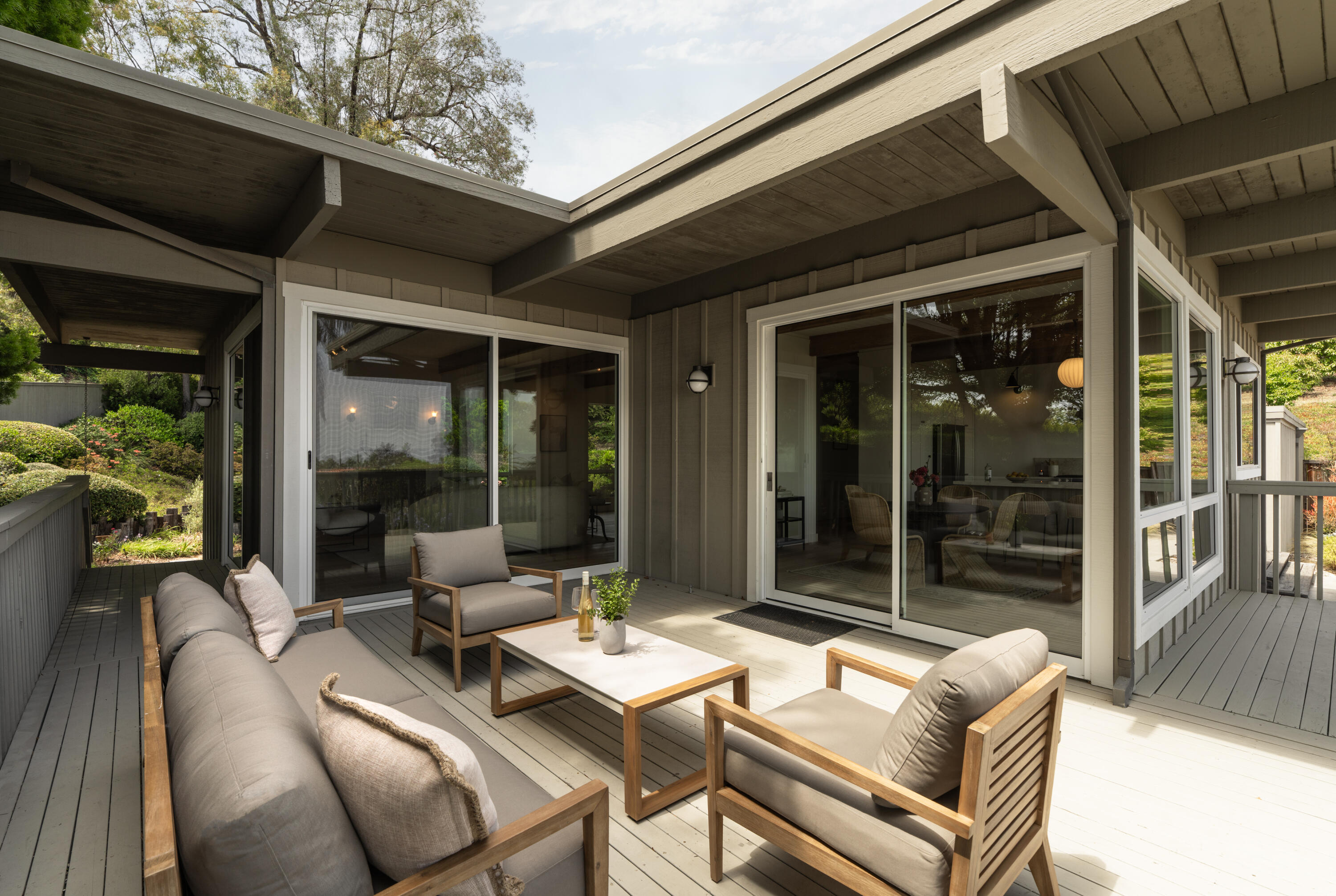 626 Sea Ranch Drive Santa Barbara, CA 93109 - Photo 34 of 38 a view of a patio with couple of chairs and a table