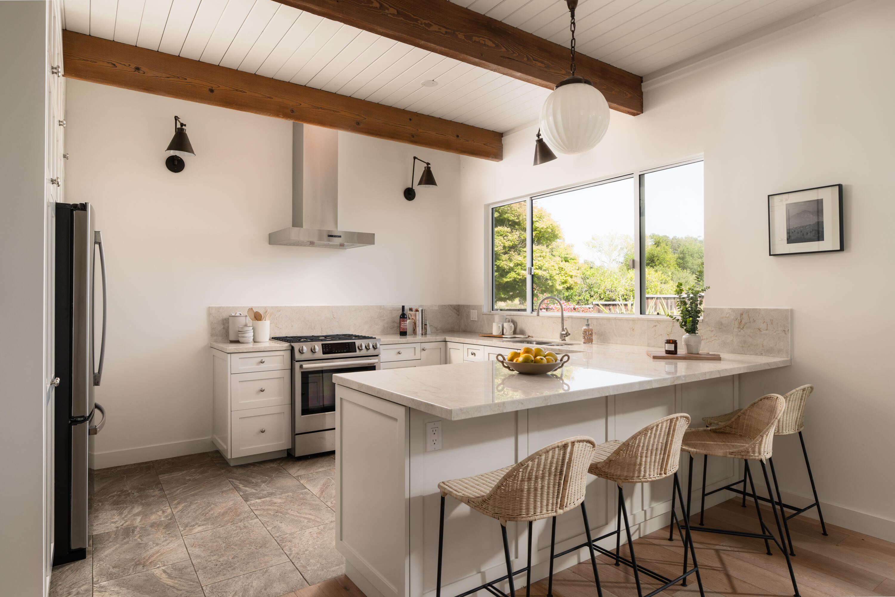 626 Sea Ranch Drive Santa Barbara, CA 93109 - Photo 7 of 38 a kitchen with stainless steel appliances a stove a sink and a refrigerator