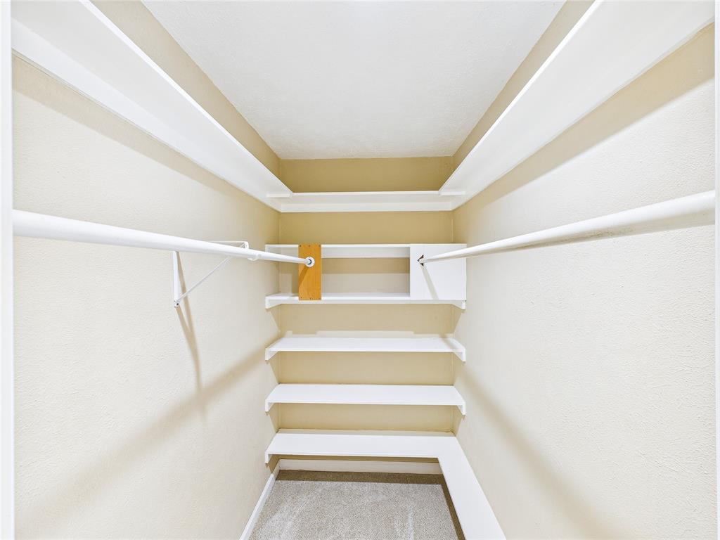 6909 Valhalla Road Fort Worth, TX 76116 - Photo 7 of 15 a view of staircase with white walls and a window