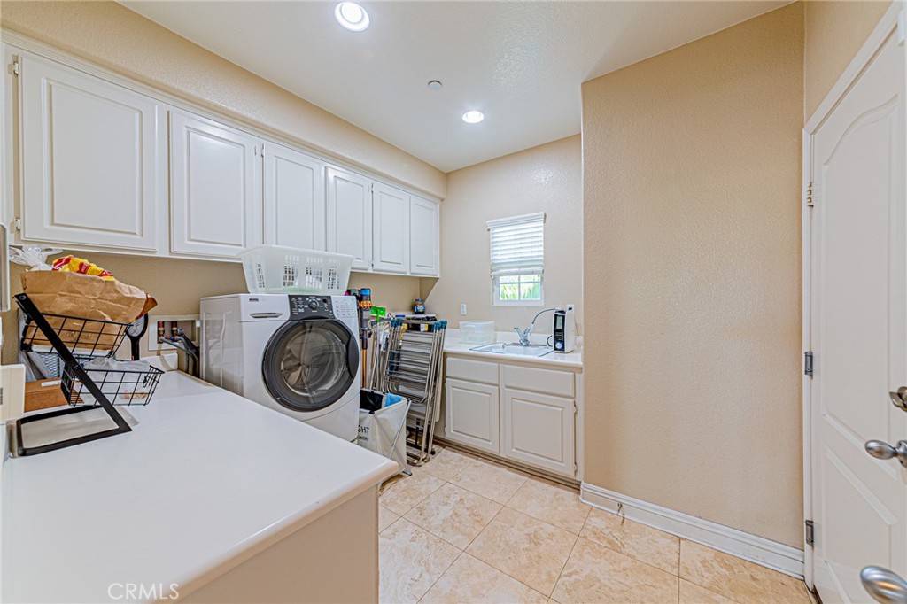 4088 Shady Ridge Circle Corona, CA 92881 - Photo 21 of 47 a view of storage and utility room with washer and dryer