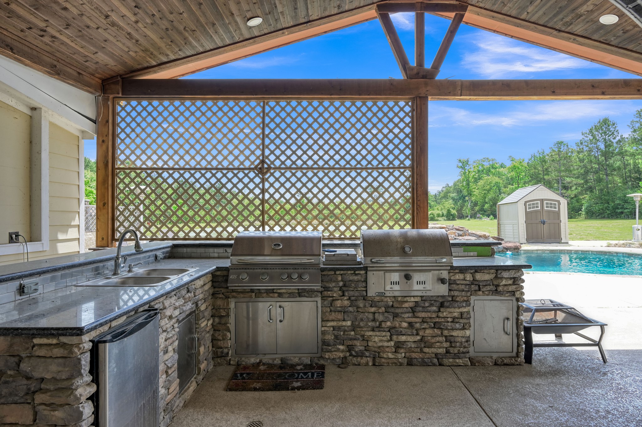 144 Wood Farm Road Huntsville, TX 77320 - Photo 27 of 35 a kitchen with a sink a stove and a table