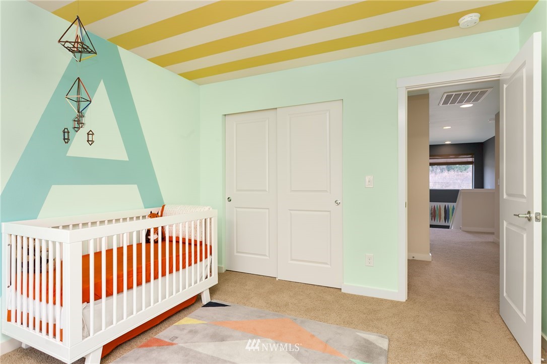 443 Partlon Street, Unit 75 Buckley, WA 98321 - Photo 13 of 25 a view of a hallway with a bedroom