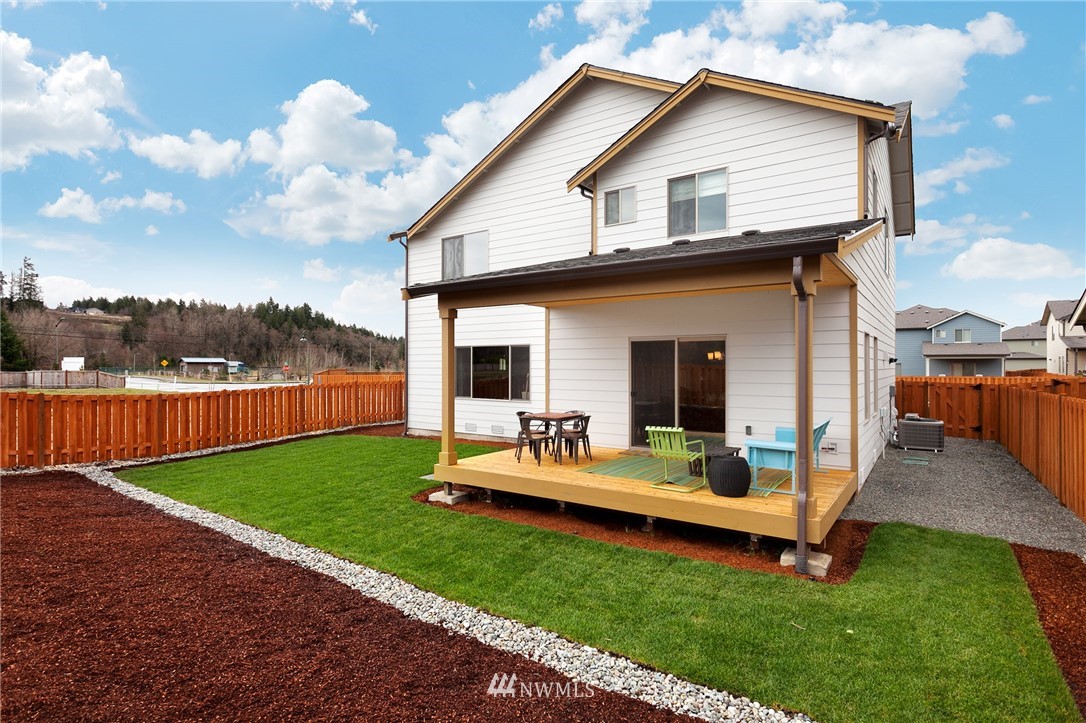 443 Partlon Street, Unit 75 Buckley, WA 98321 - Photo 23 of 25 a front view of house with yard outdoor seating and barbeque oven