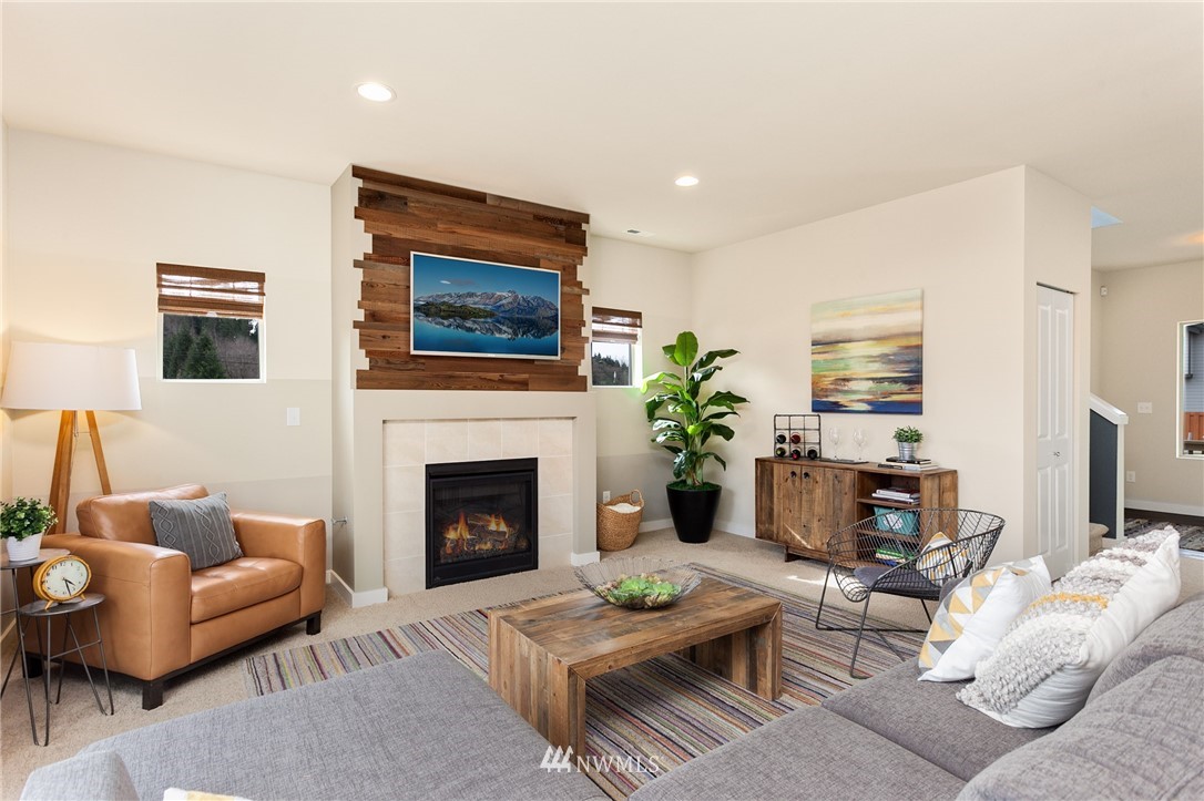 443 Partlon Street, Unit 75 Buckley, WA 98321 - Photo 9 of 25 a living room with furniture and a fireplace
