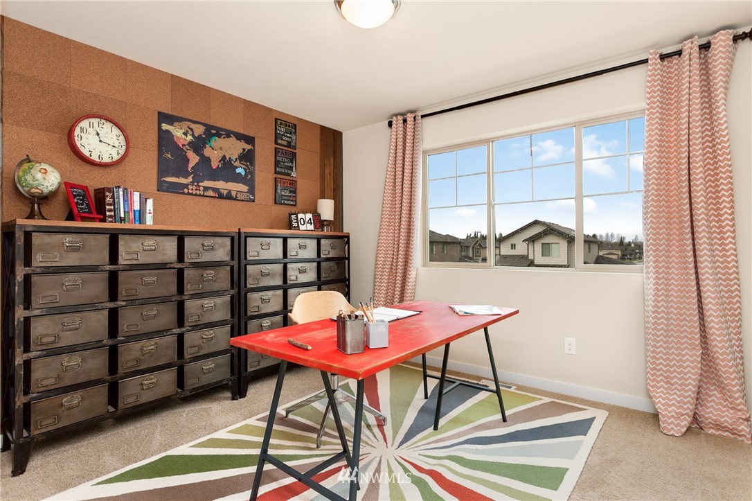 443 Partlon Street, Unit 75 Buckley, WA 98321 - Photo 10 of 25 a view of a room with furniture and window
