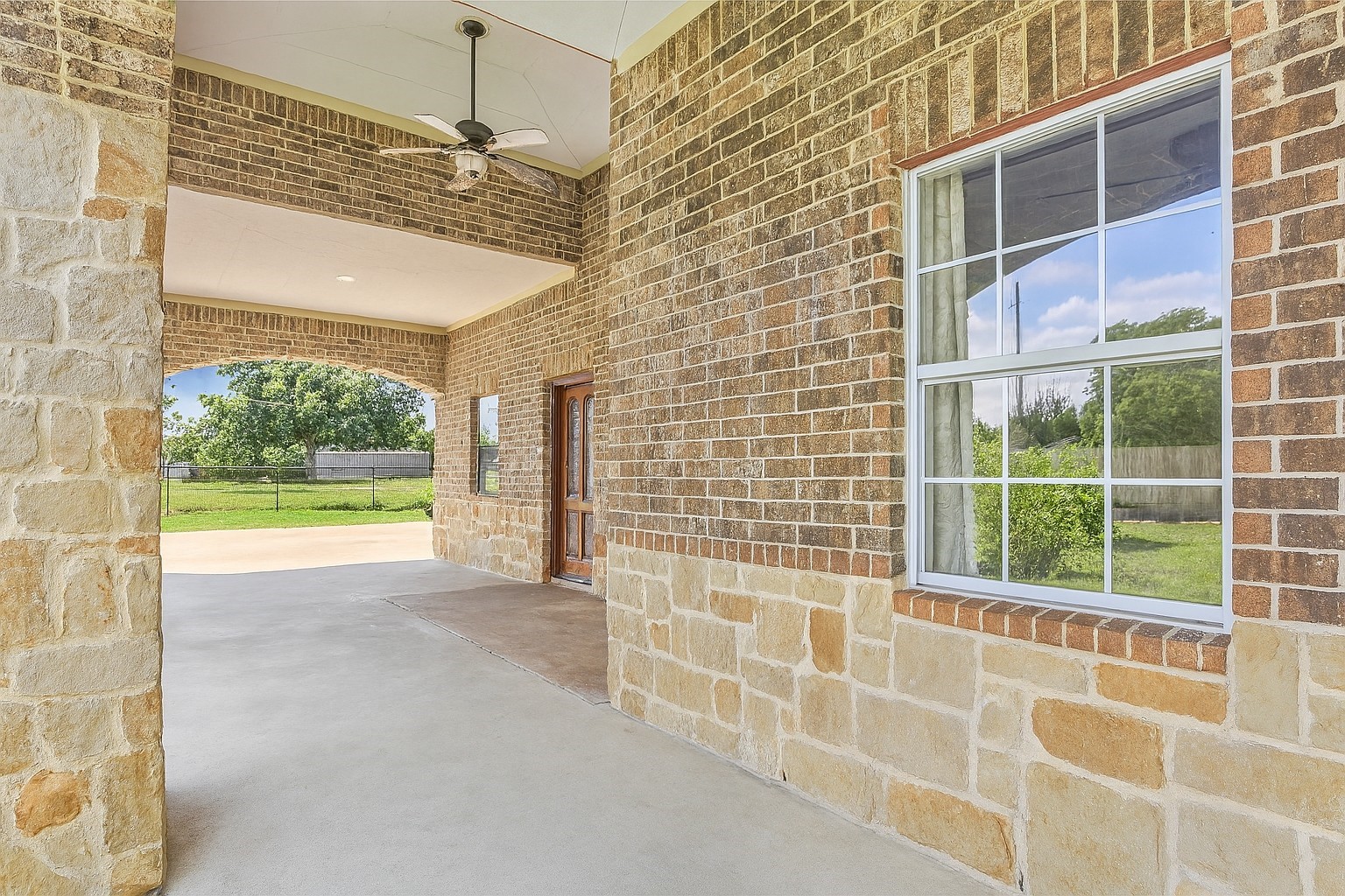 15123 Lindstrom Road Crosby, TX 77532 - Photo 12 of 39 The expansive covered front porch adds timeless curb appeal while extending your living space outdoors, creating a comfortable retreat rain or shine.