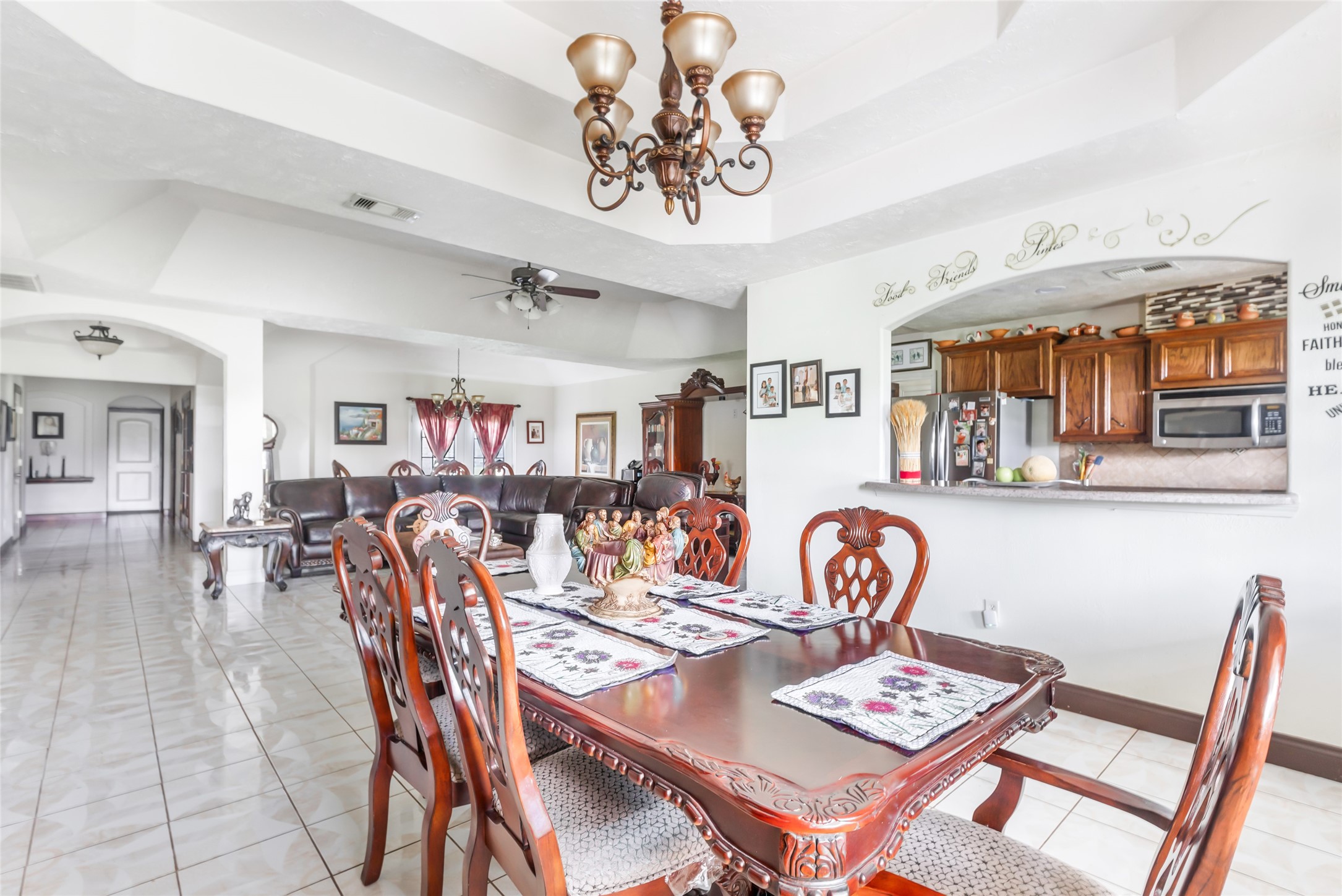 15123 Lindstrom Road Crosby, TX 77532 - Photo 17 of 39 Enjoy family meals or casual gatherings in the designated dining area, perfectly connected to the kitchen by a pass-through window that makes entertaining effortless.