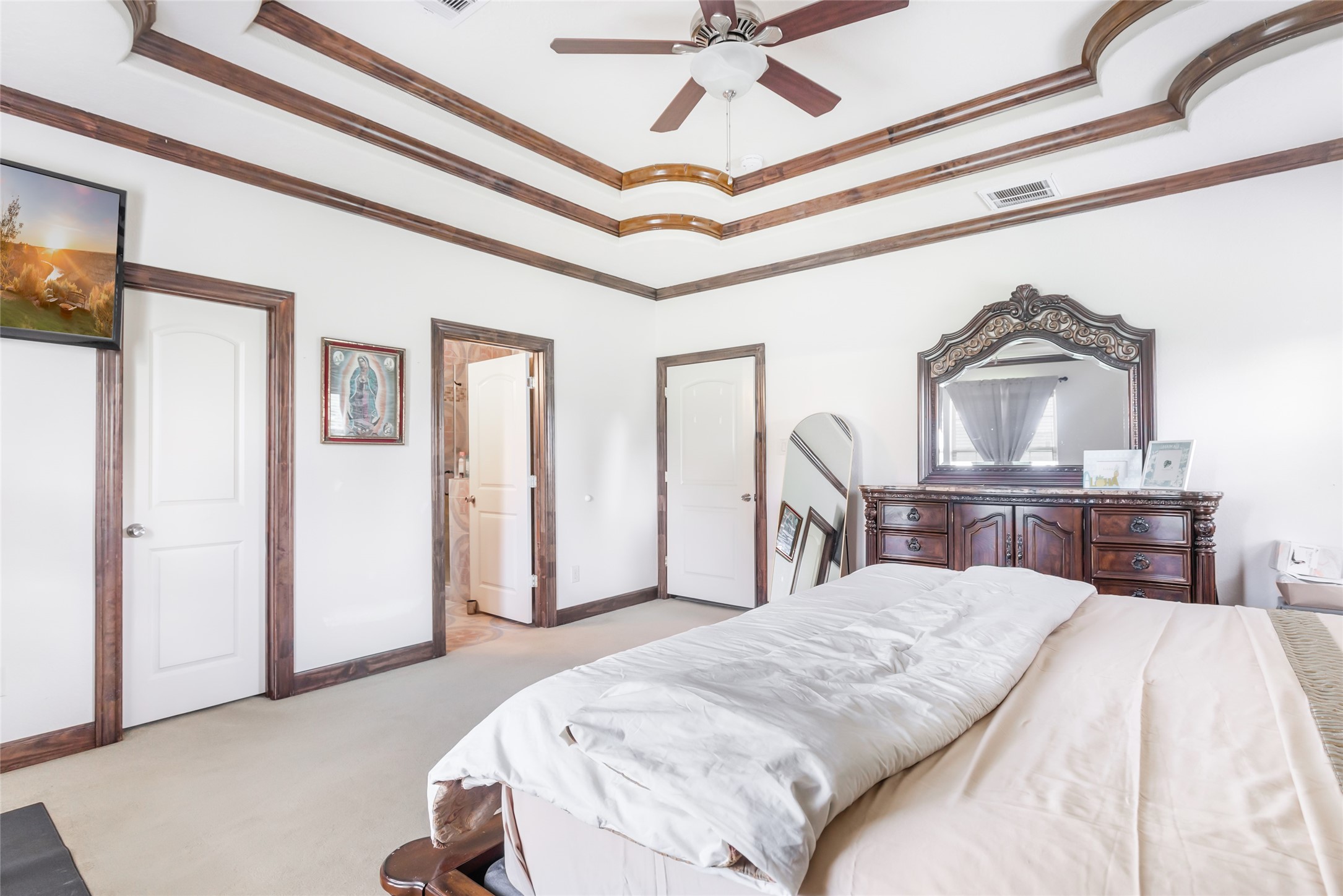 15123 Lindstrom Road Crosby, TX 77532 - Photo 21 of 39 a bedroom with a bed and a chandelier