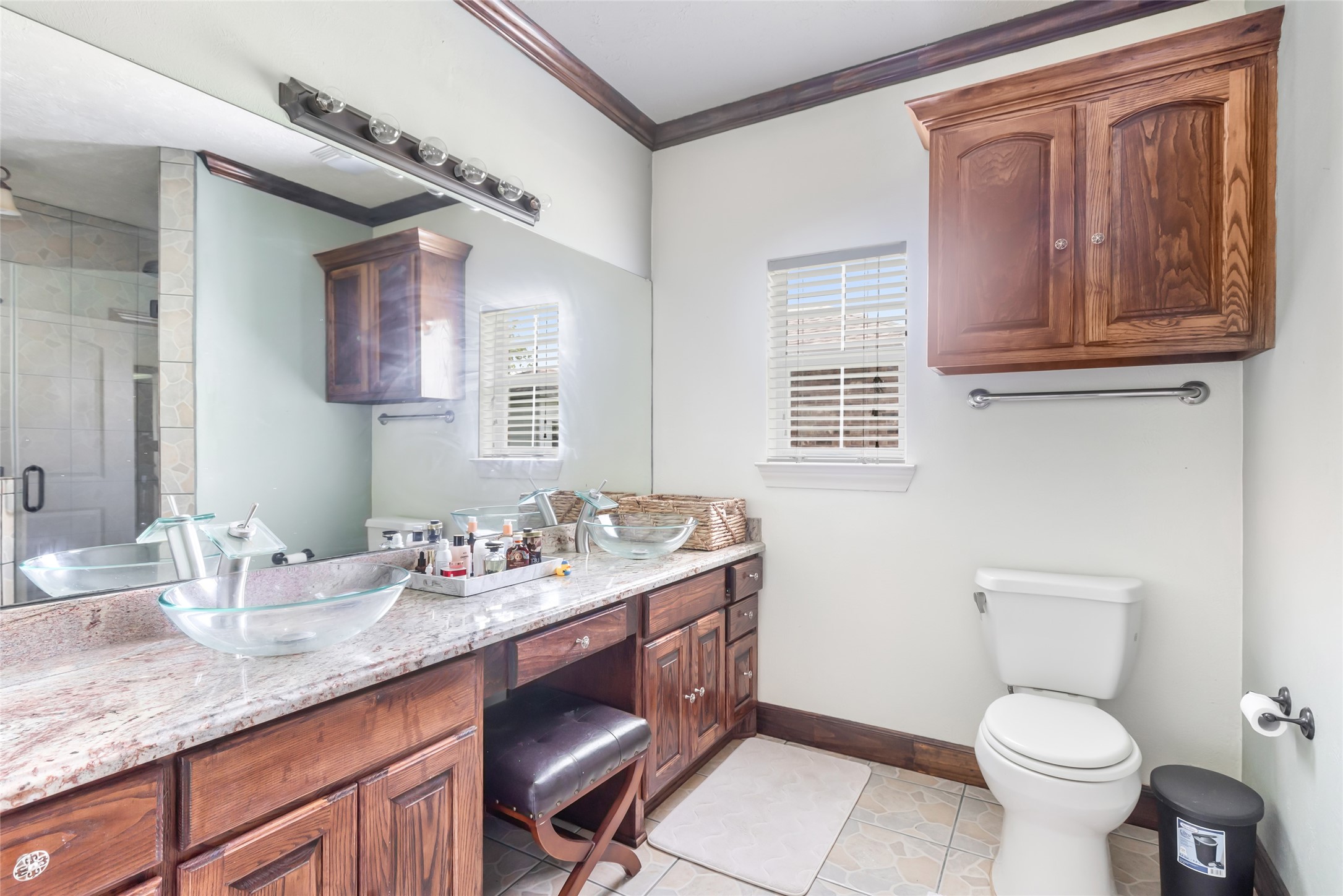 15123 Lindstrom Road Crosby, TX 77532 - Photo 28 of 39 a bathroom with a granite countertop toilet sink and mirror