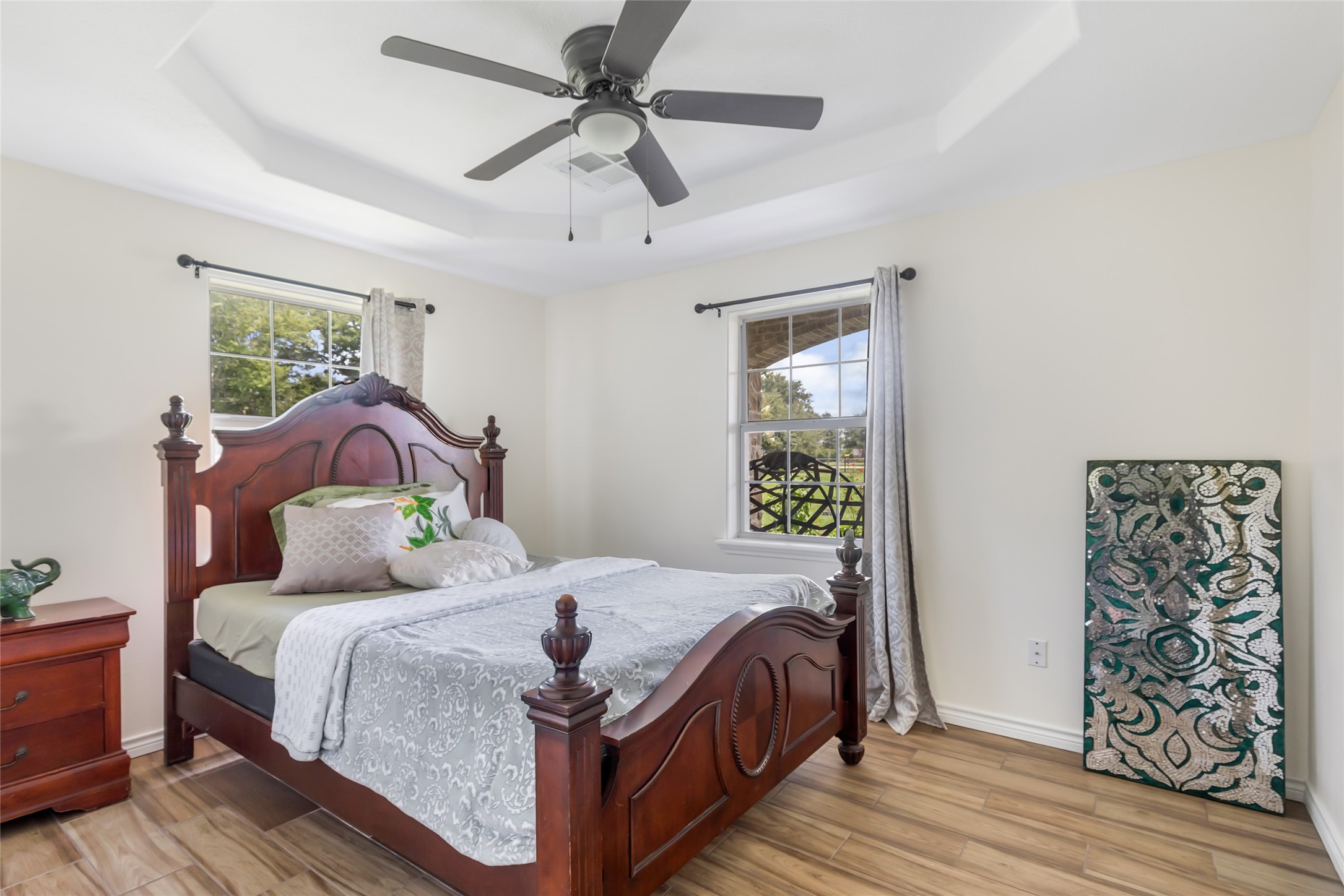 15123 Lindstrom Road Crosby, TX 77532 - Photo 30 of 39 a bedroom with a bed and wooden floor