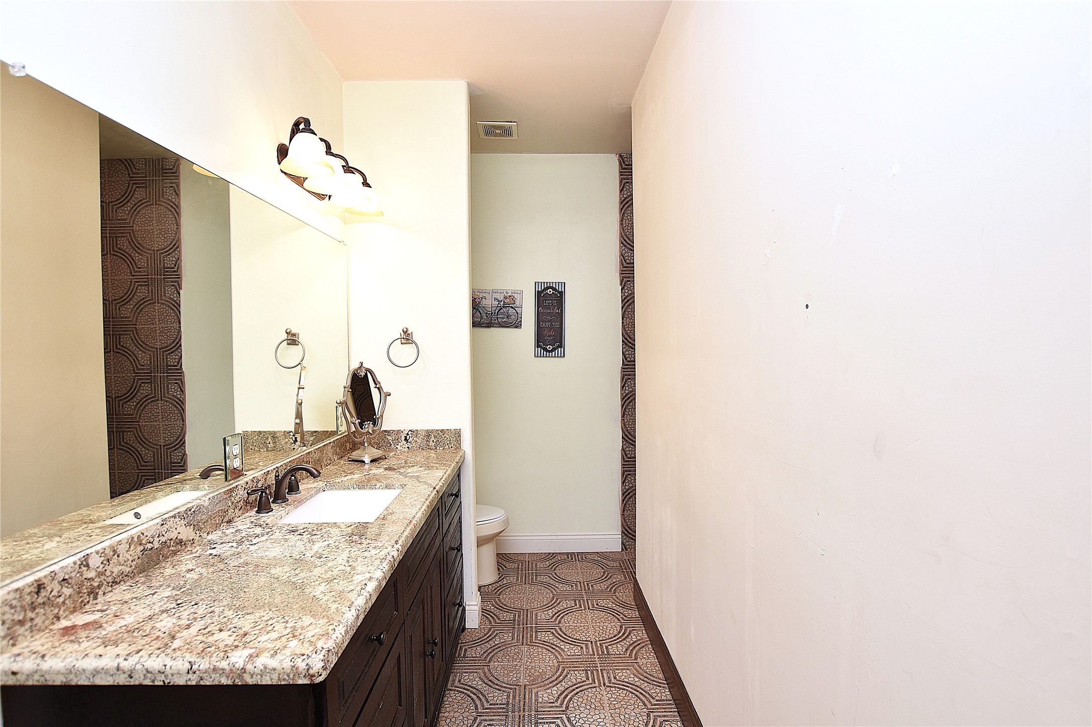 15123 Lindstrom Road Crosby, TX 77532 - Photo 36 of 39 This fifth bathroom offers privacy and convenience with direct access from the adjoining bedroom, complete with a walk-in shower and updated vanity.