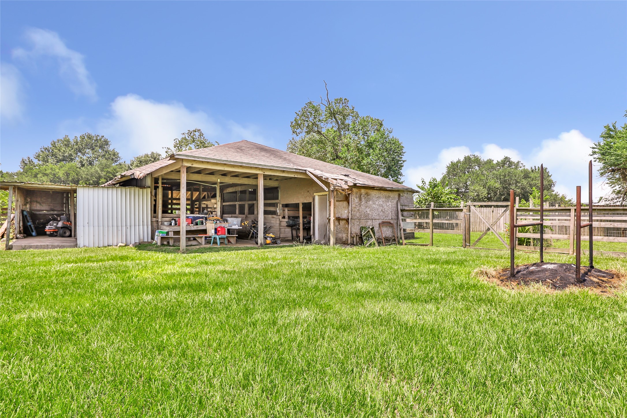 15123 Lindstrom Road Crosby, TX 77532 - Photo 39 of 39 a view of a house with backyard and a tree
