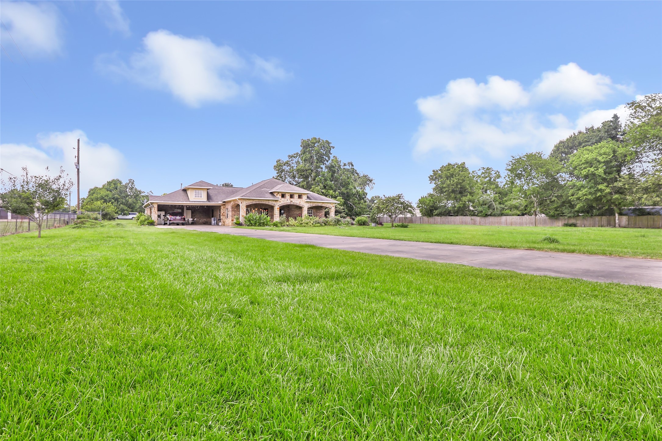 15123 Lindstrom Road Crosby, TX 77532 - Photo 8 of 39 a view of a house with a big yard and large trees