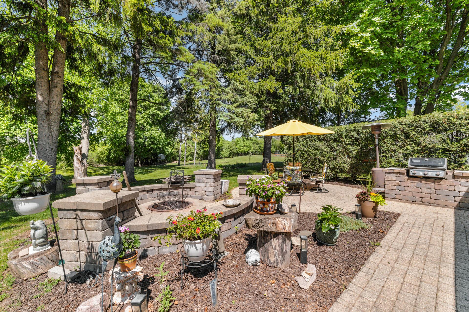 7124 Pioneer Road Cedarburg, WI 53012 - Photo 22 of 32 Fire pit and stone knee walls