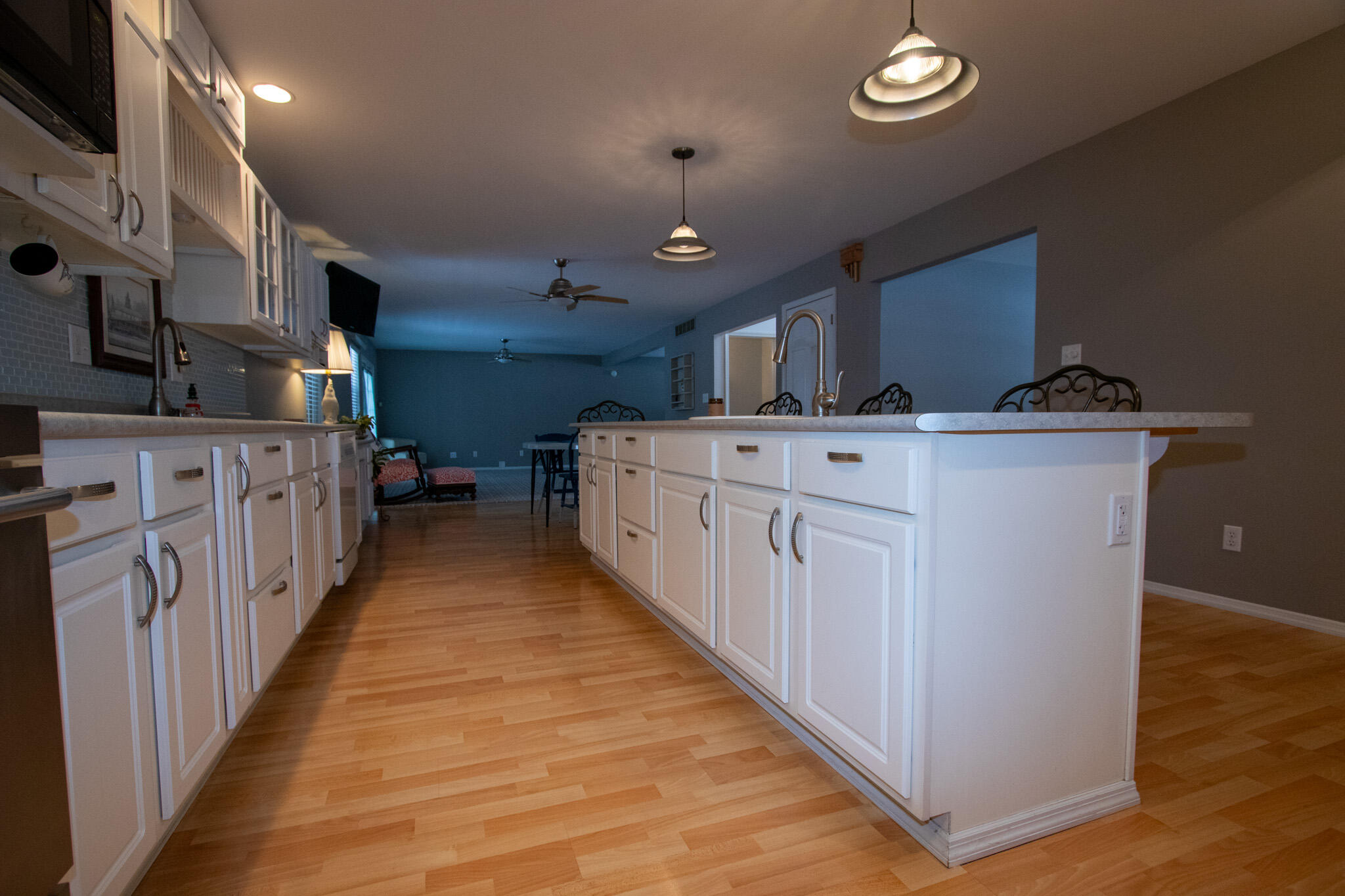 107 Center Street Michigan City, IN 46360 - Photo 12 of 67 a kitchen with stainless steel appliances a sink and cabinets