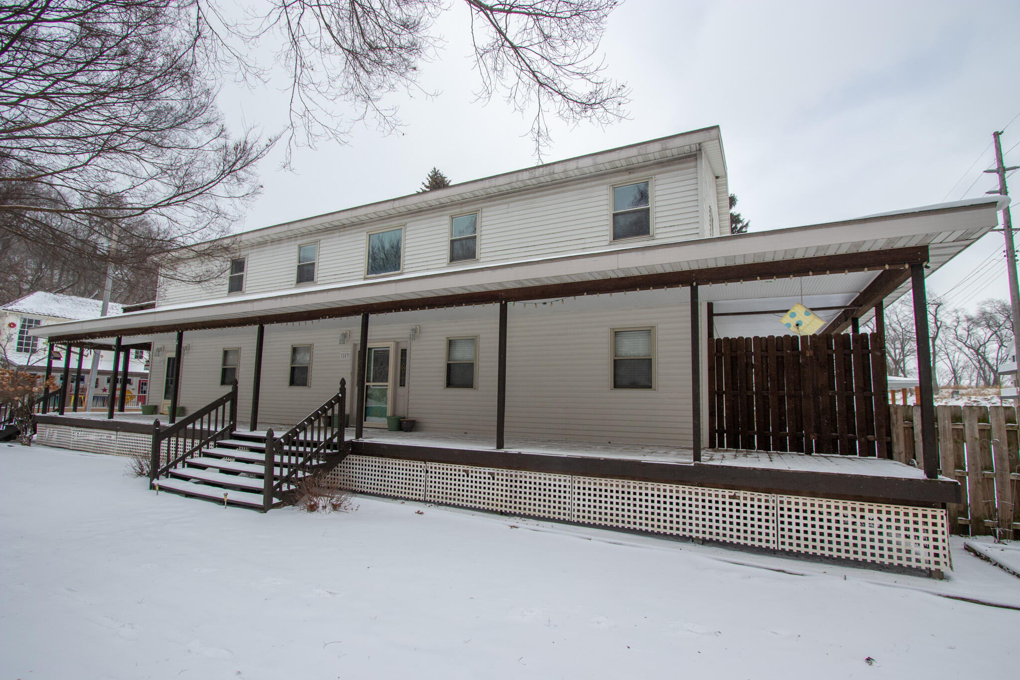 107 Center Street Michigan City, IN 46360 - Photo 2 of 67 front view of a house with a fence